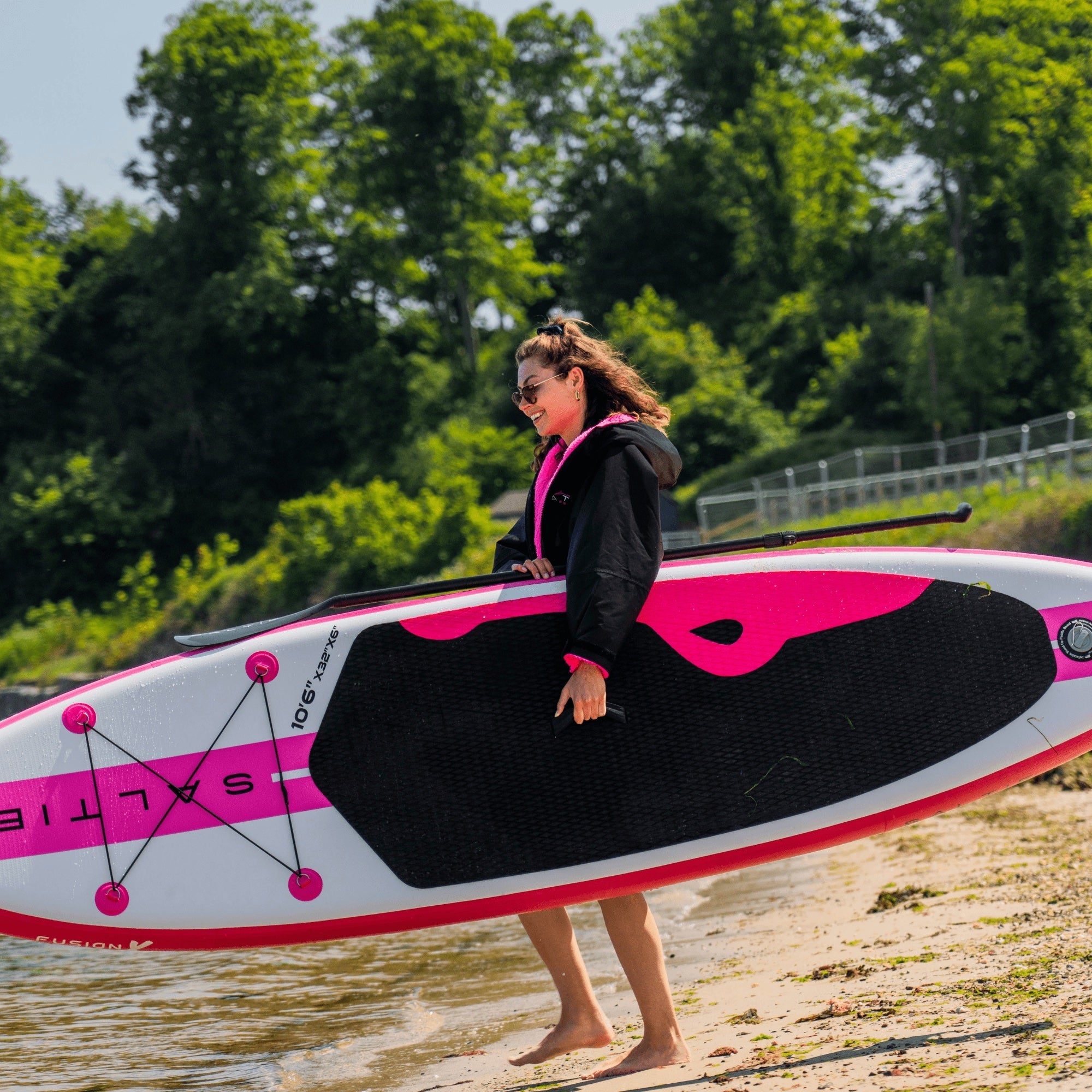 SALTIE Changing Robe in pink, weather resistant, perfect for changing on the beach and made using 100% recycled materials. The SALTIE changing robe is designed keep you warm and dry during your sea swim, beach walks and all of your outdoor adventures.